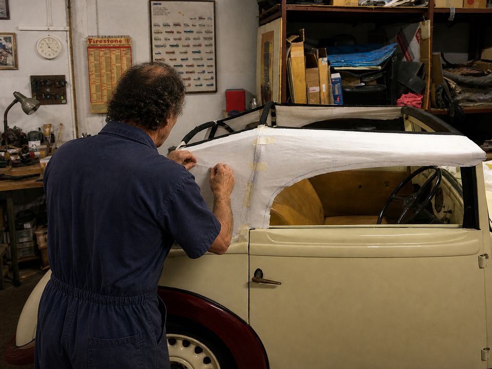Mimmo working on the top of a convertible